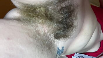 Close up of a hairy cunt bush in a solo homemade video