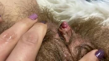 Close up of a yam-sized ejaculation from a immense clitoris bulge in an amateur video.